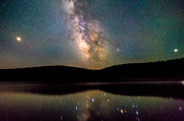 milky way reflected in lake