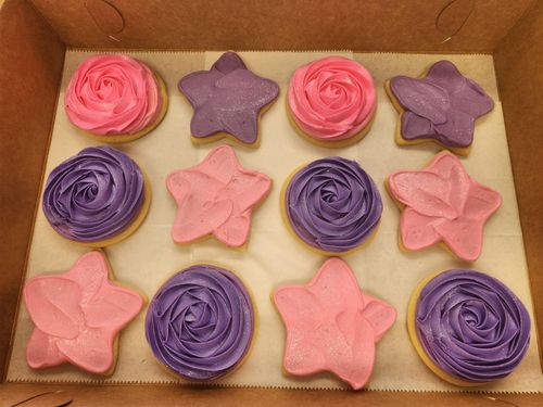 A pile of colorful cookies with smiley faces on them