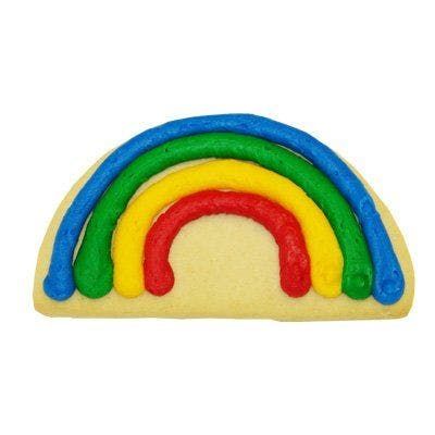 A cookie in the shape of a rainbow with red yellow and blue frosting