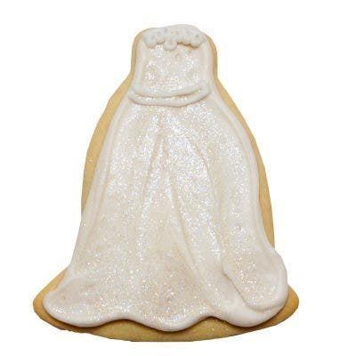 A cookie in the shape of a wedding dress