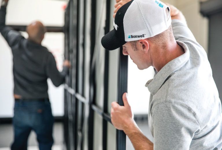 a man wearing a hat that says boxwell on it
