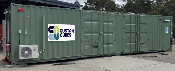 a tow truck with a container on the back is parked in front of a house .