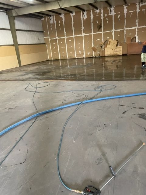 A hose is laying on the floor of a building