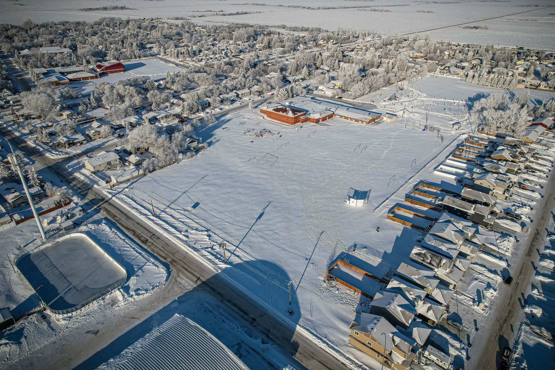 An aerial view of a city covered in snow