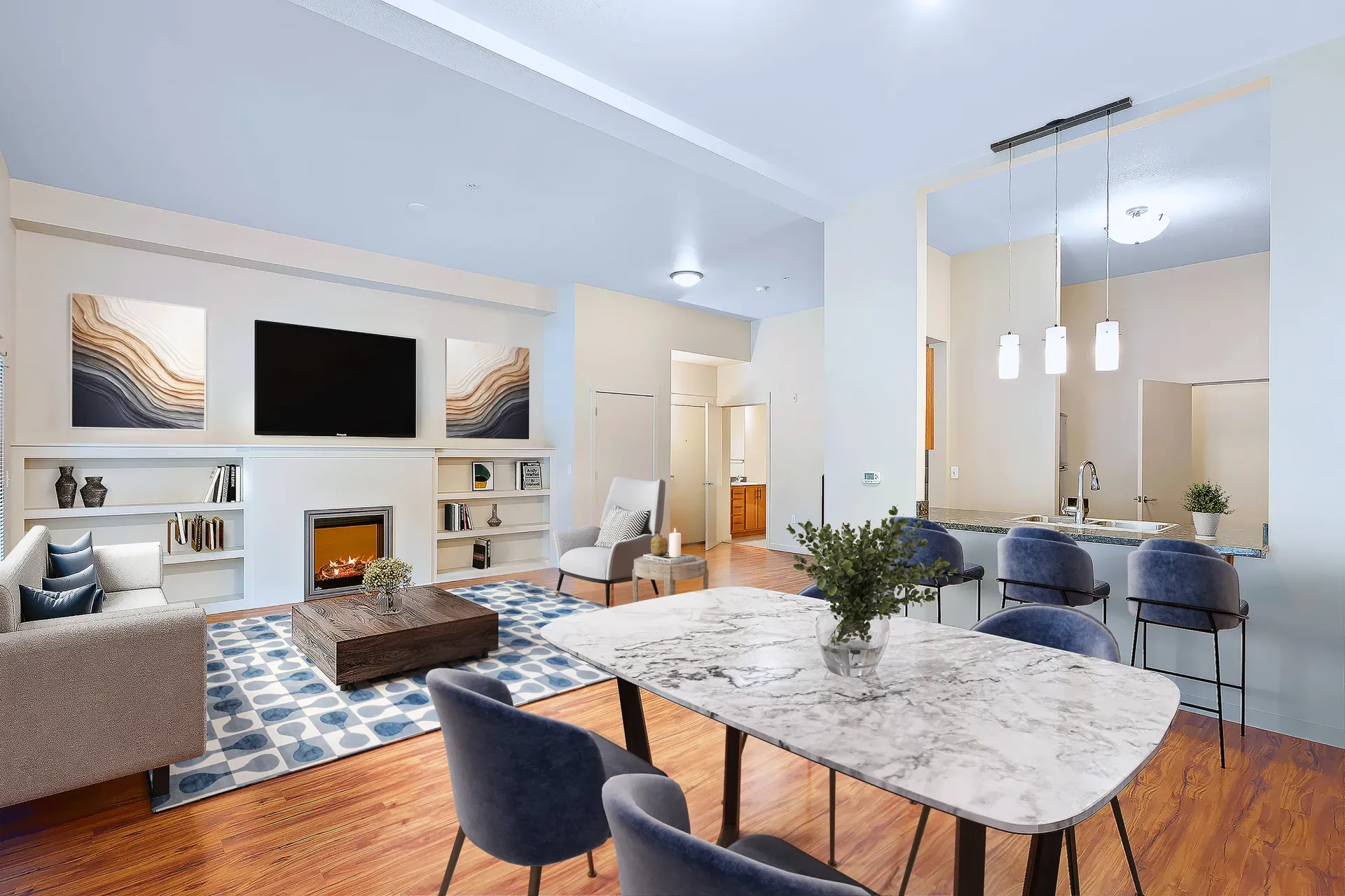 Modern apartment living room with fireplace, built-in shelves, and a marble dining table.