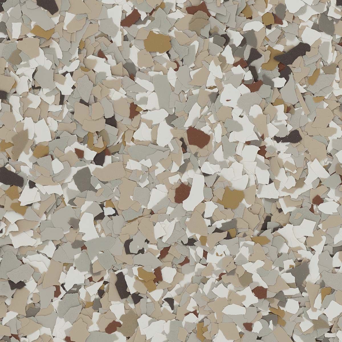 Multi-colored decorative floor chips in a speckled pattern, featuring tan, white, brown and gray.