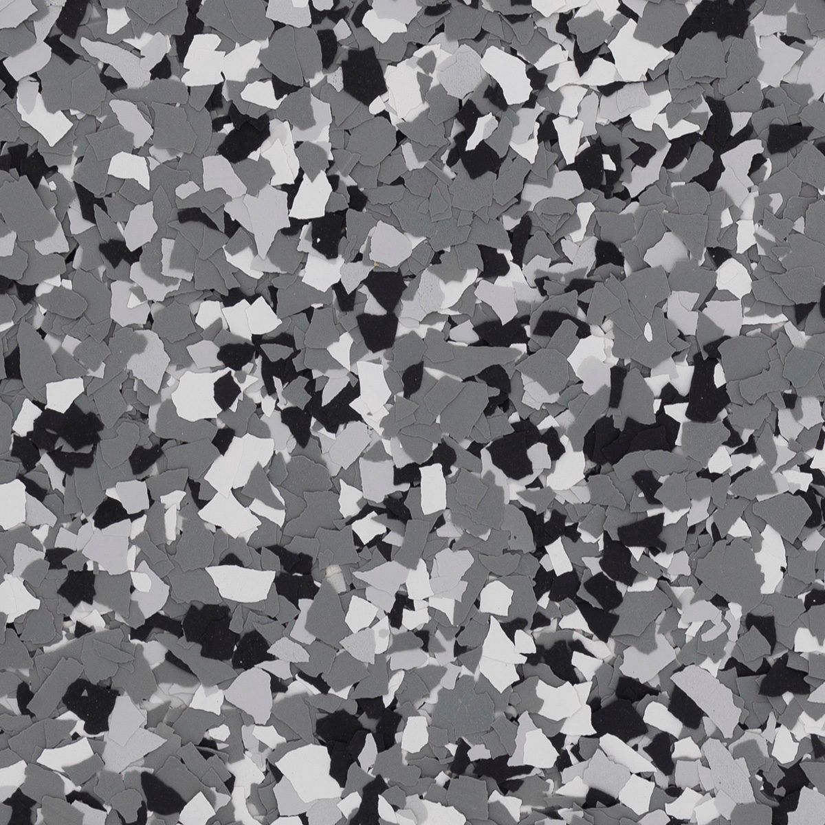 Gray, black, and white speckled flooring, resembling a terrazzo or epoxy surface.