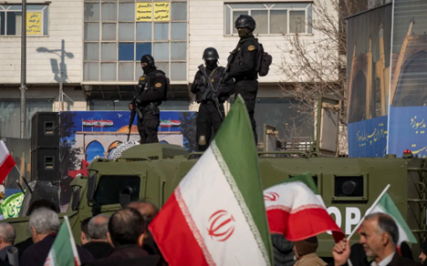 Iran military on top of tank