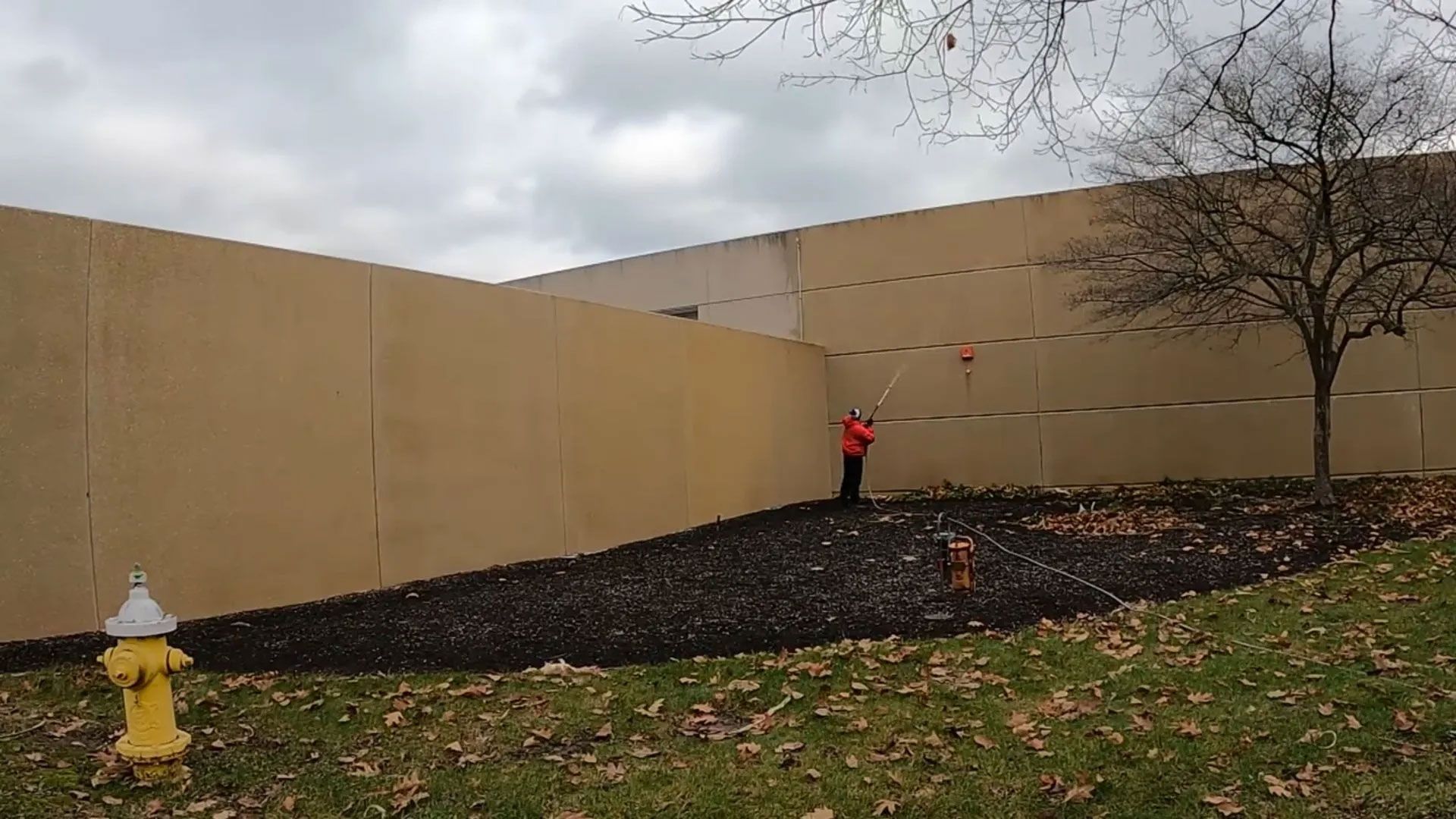 Power Washing the Wall of the Commercial Building