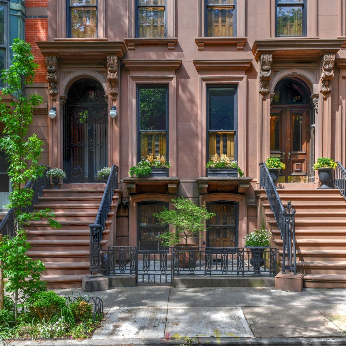 A building with stairs leading up to the front door