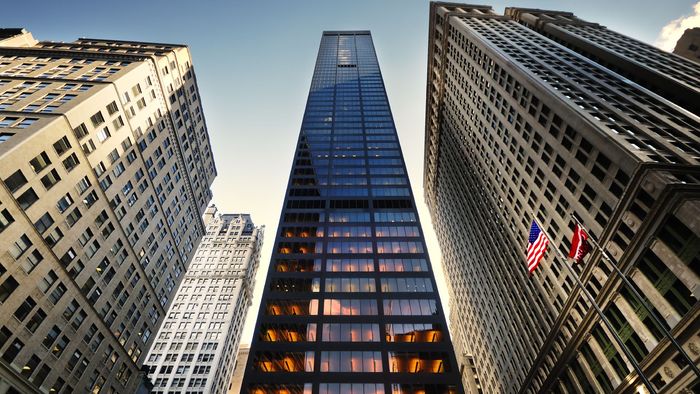 Looking up at a tall building in a city