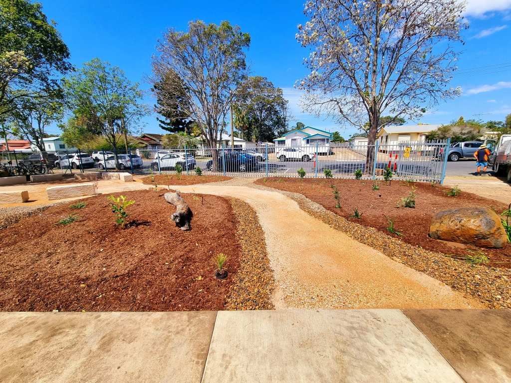 Pathway Through Landscaped Garden Bed With Bark, Plants, Rocks — On The Mark Landscaping in Elliot Heads, QLD