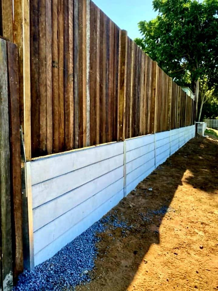 Wooden Fence With Concrete Base, Gravel Bed at Ground Level — On The Mark Landscaping in Branyan, QLD