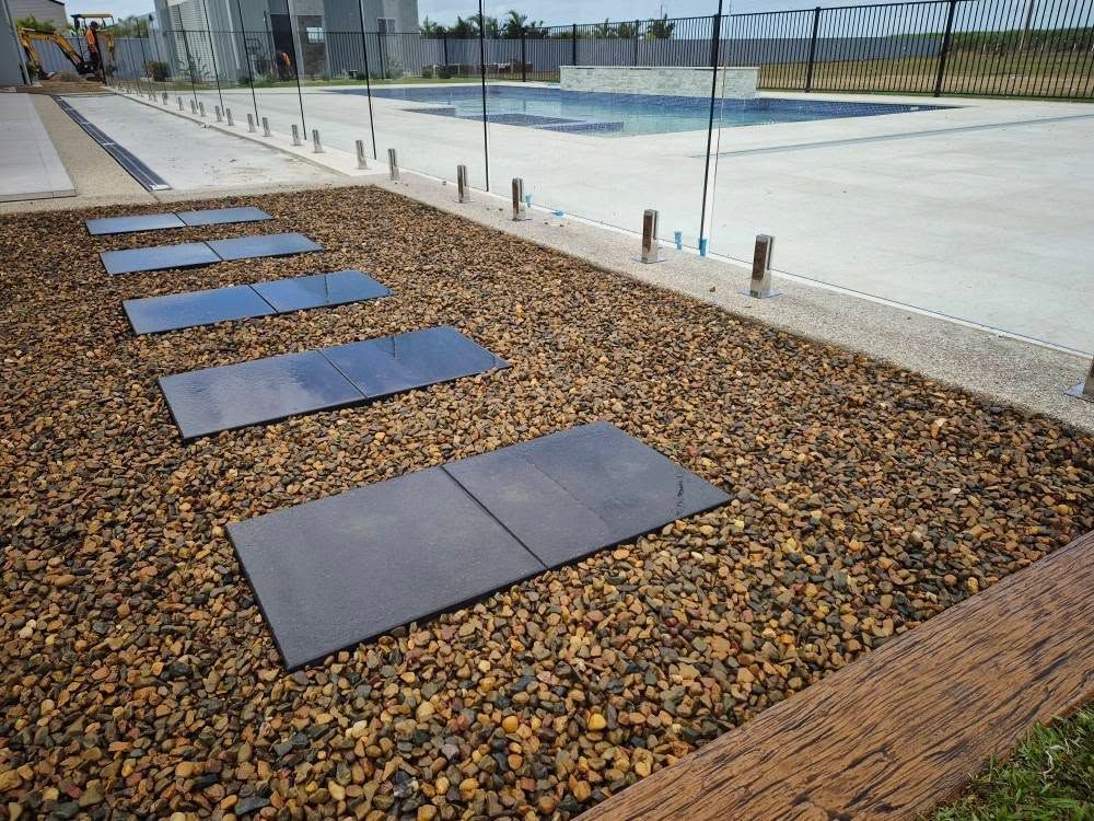 Stepping Stones Across Pebble Bed Near Pool — On The Mark Landscaping in Branyan, QLD