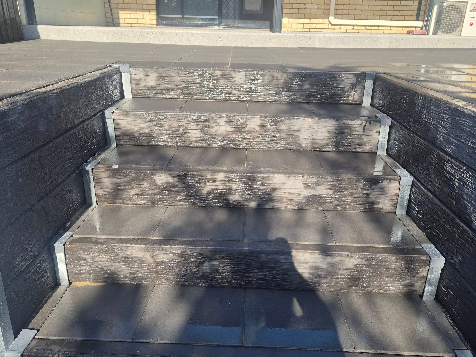 Steps Made of Dark-colored, Weathered Wood and Gray Tiles, Leading to a Building — On The Mark Landscaping in Branyan, QLD