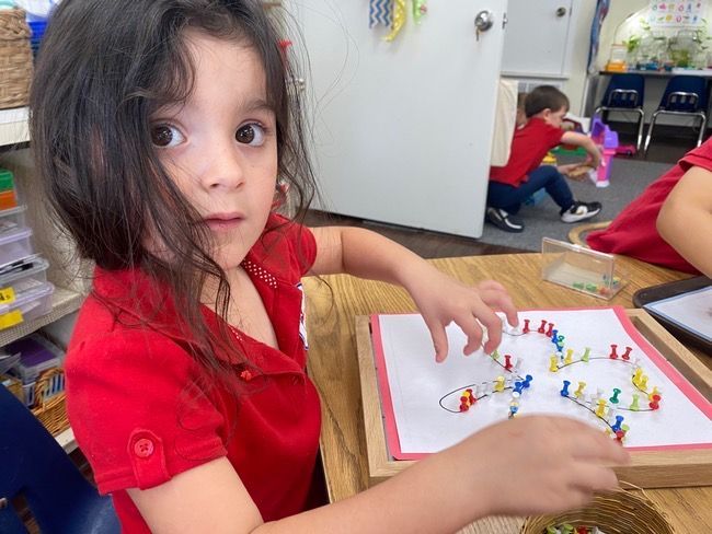 young girl talking with others