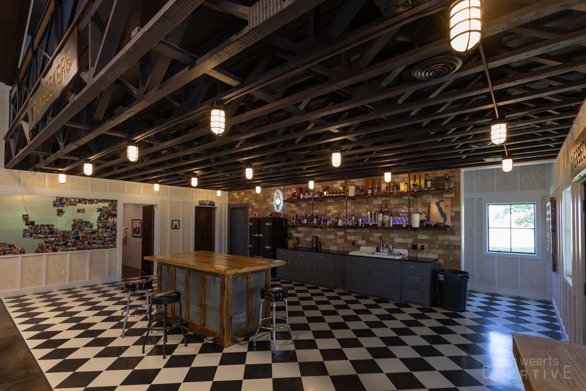 A large room with a checkered floor and a table