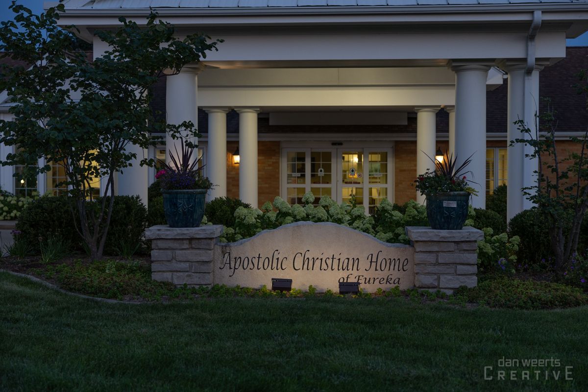 A large building with a sign in front of it that says apostolic christian home