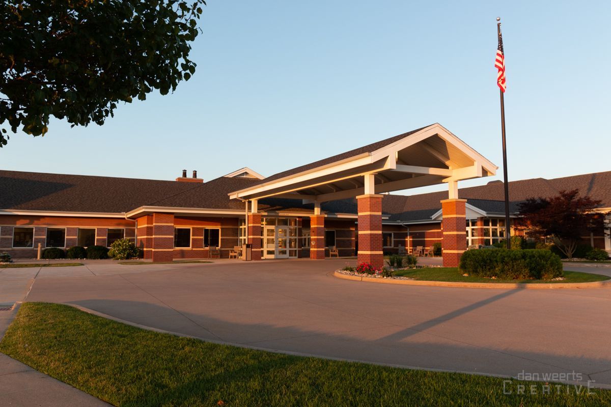 A large building with an american flag in front of it