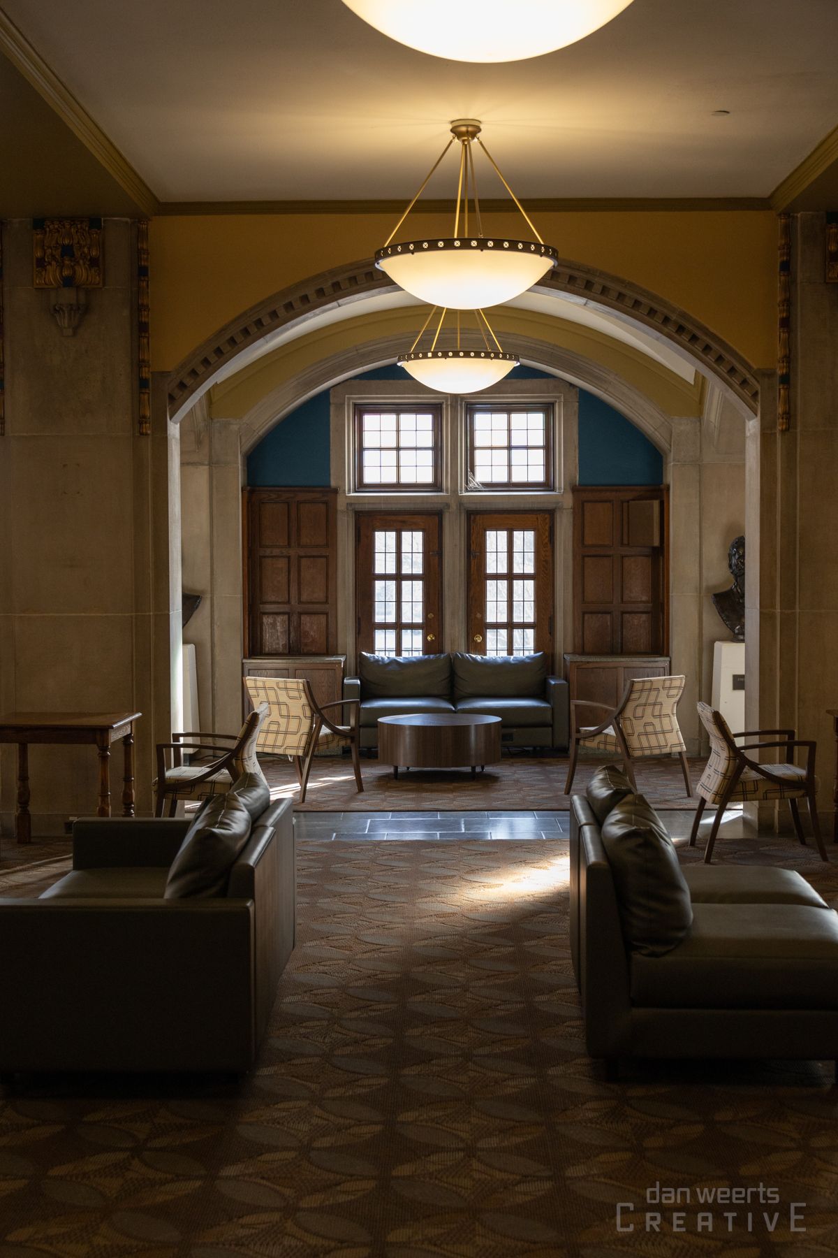 A living room filled with furniture and a chandelier.