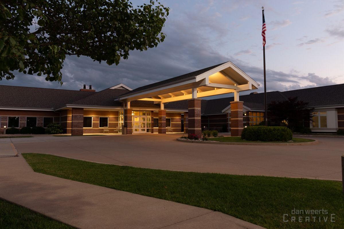 A large building with an american flag in front of it