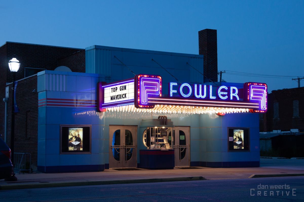 The fowler theater is lit up at night
