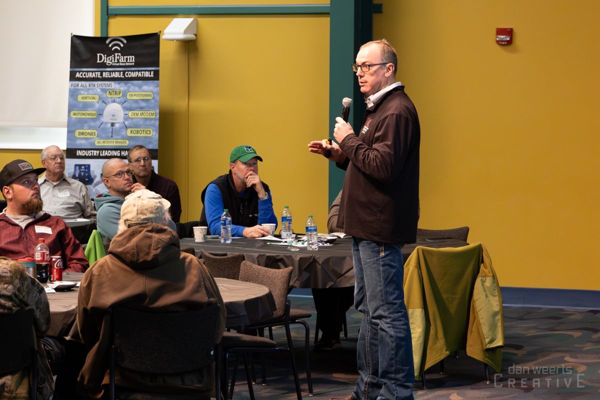 A man is giving a presentation to a group of people