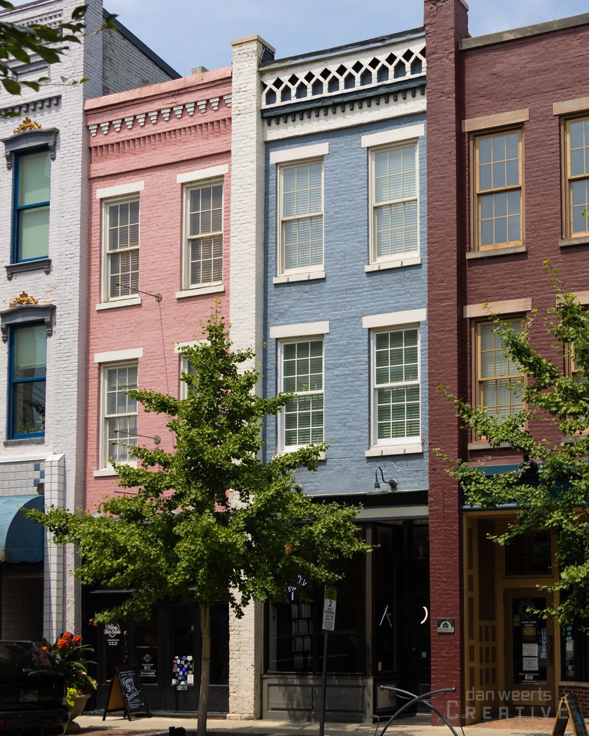 A row of buildings with one that says liberty on it