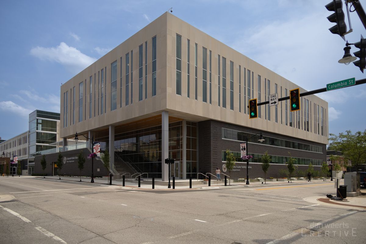 A large building with a green traffic light in front of it