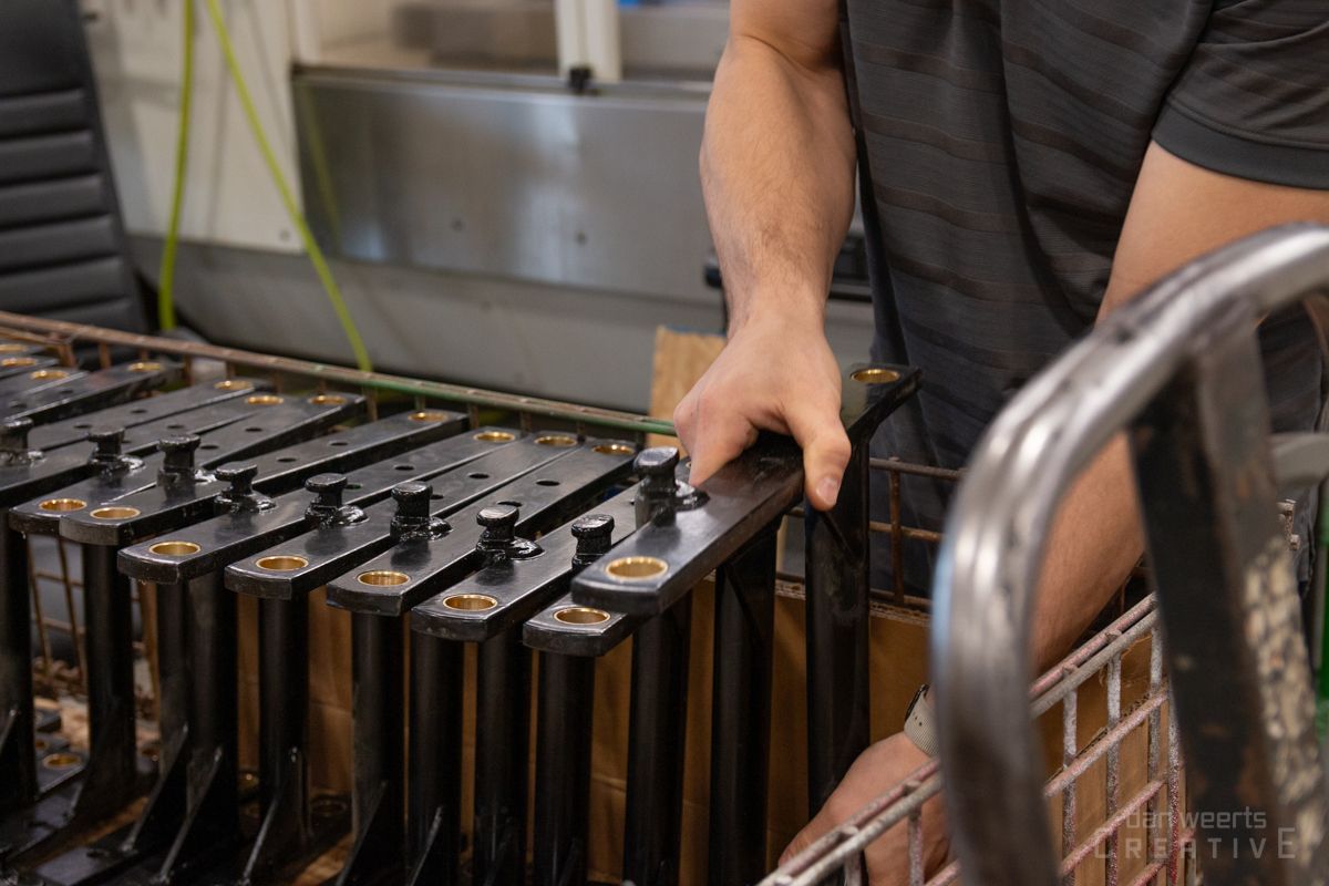 A man is working on a machine in a factory.