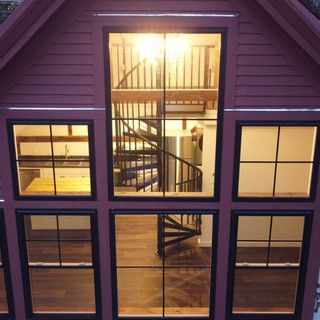 A house with a spiral staircase and lots of windows
