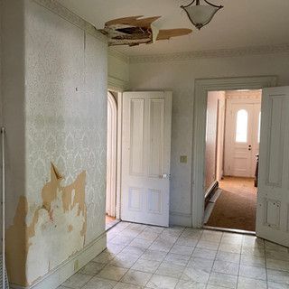 There is a hole in the ceiling in the middle of the room.