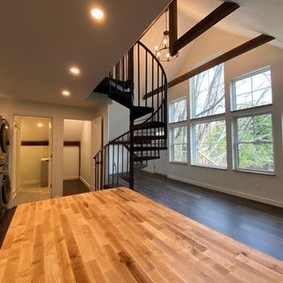 There is a spiral staircase in the middle of the room.