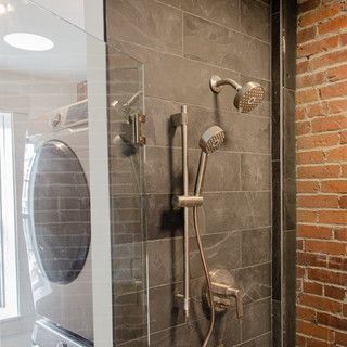 There is a washer and dryer in the shower.