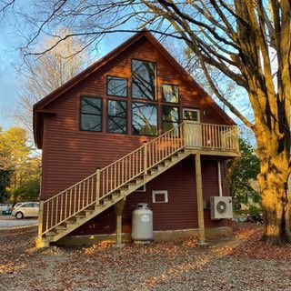 A large house with stairs leading up to the second floor.