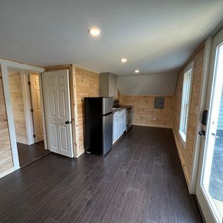 There is a refrigerator in the middle of the room.