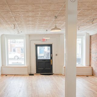 There is a black door in the middle of the room.