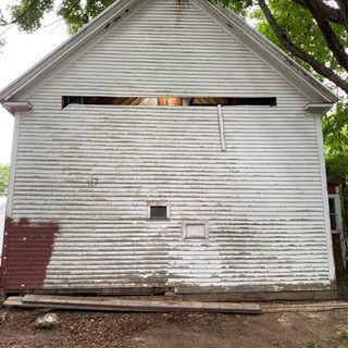 A white building with a window on the side