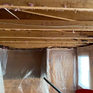 A room with a ceiling that is covered in plastic.