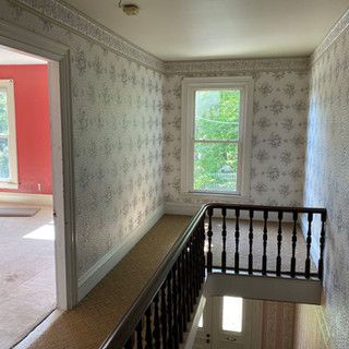 There is a staircase leading up to the second floor of a house.