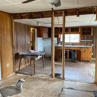 A kitchen and dining room are being remodeled in a mobile home.