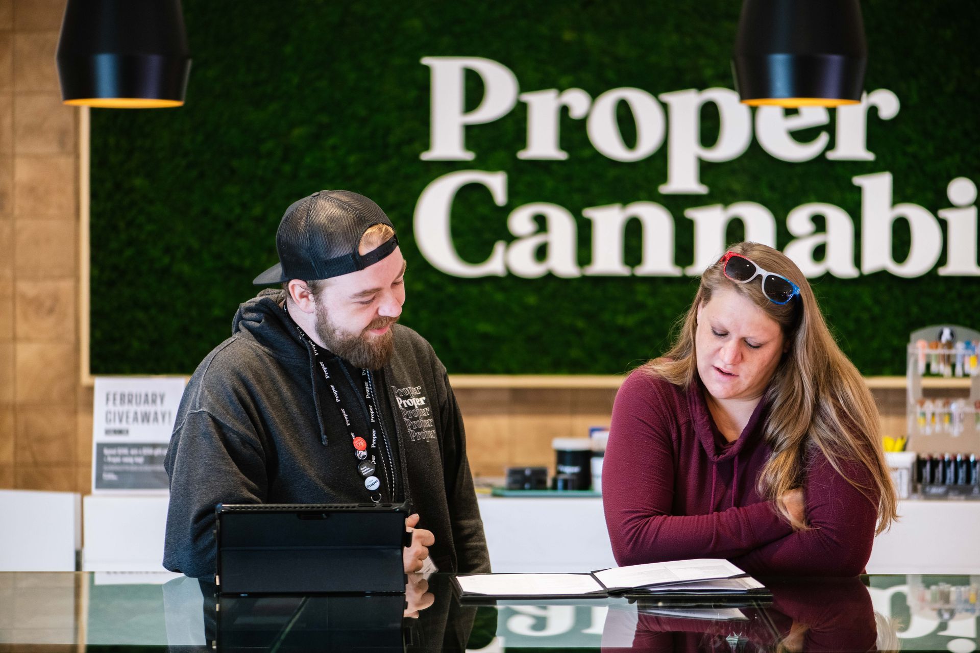 Budtender helping customer