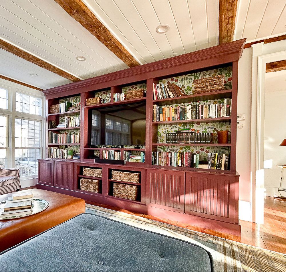 A living room with large built-in bookshelves