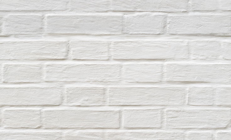 A close up of a white brick wall.