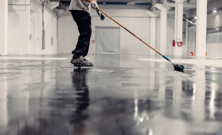 A man is applying an epoxy floor.