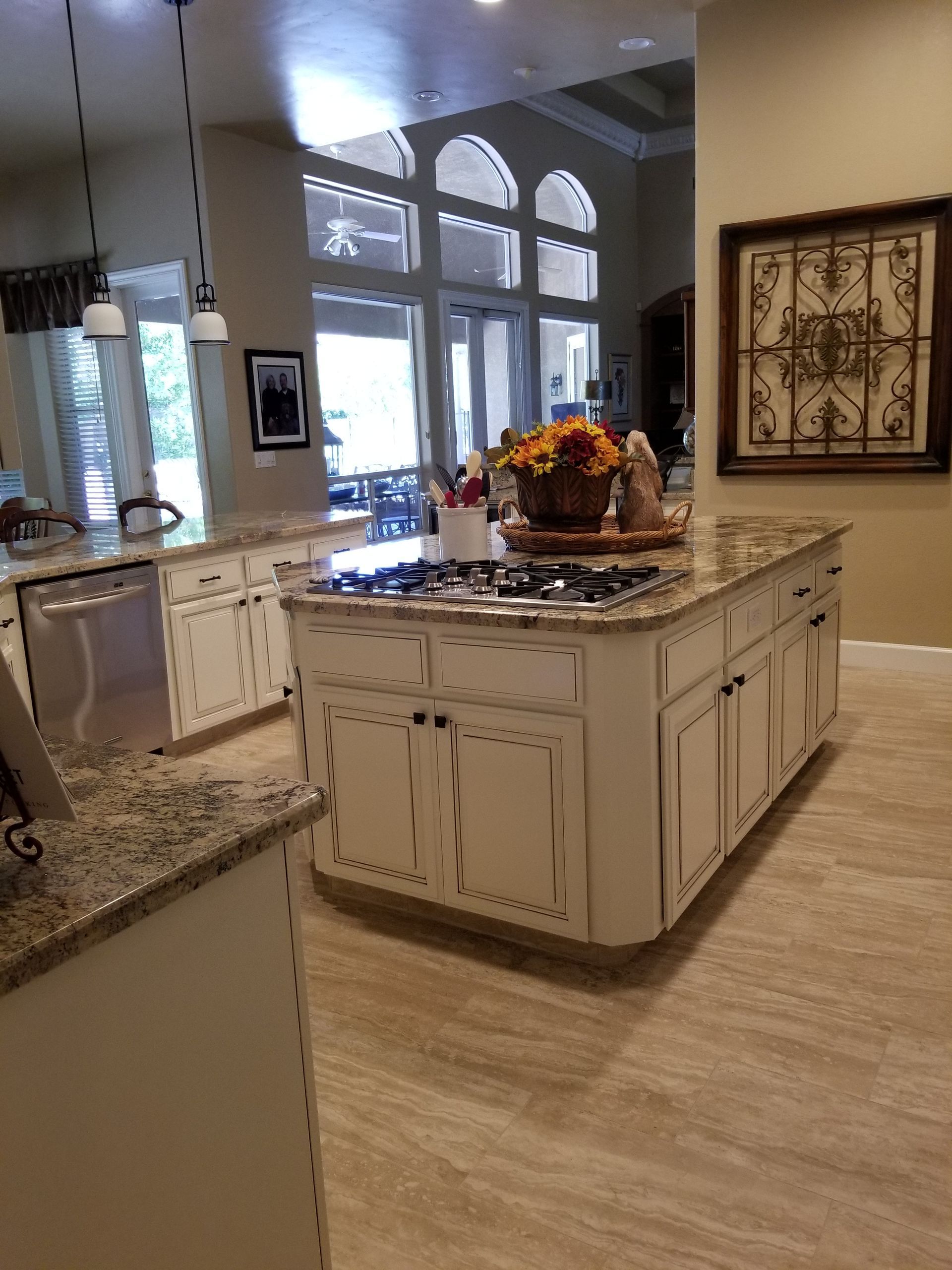 A kitchen with a large island in the middle of it