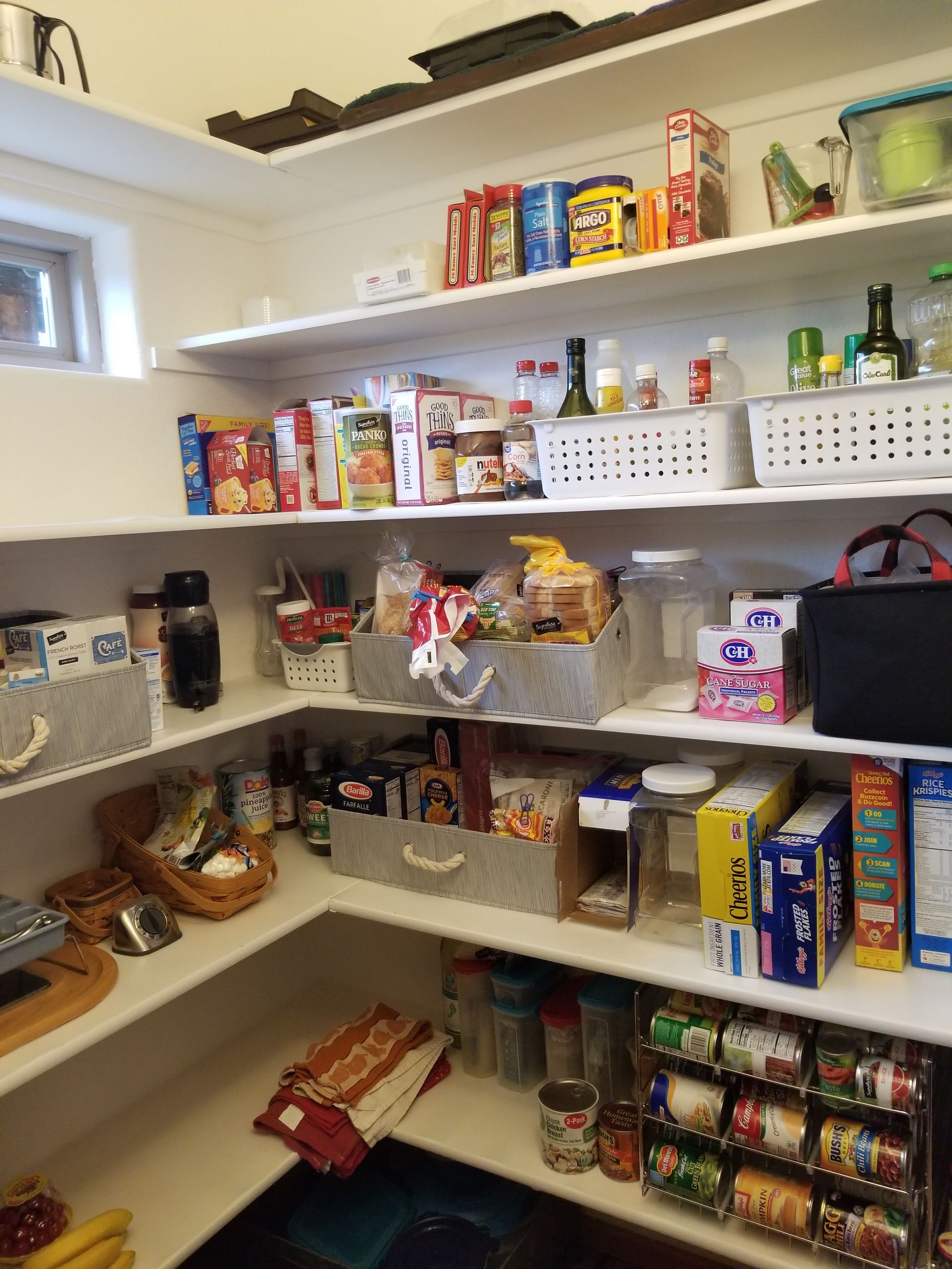 A pantry filled with lots of food including cereal
