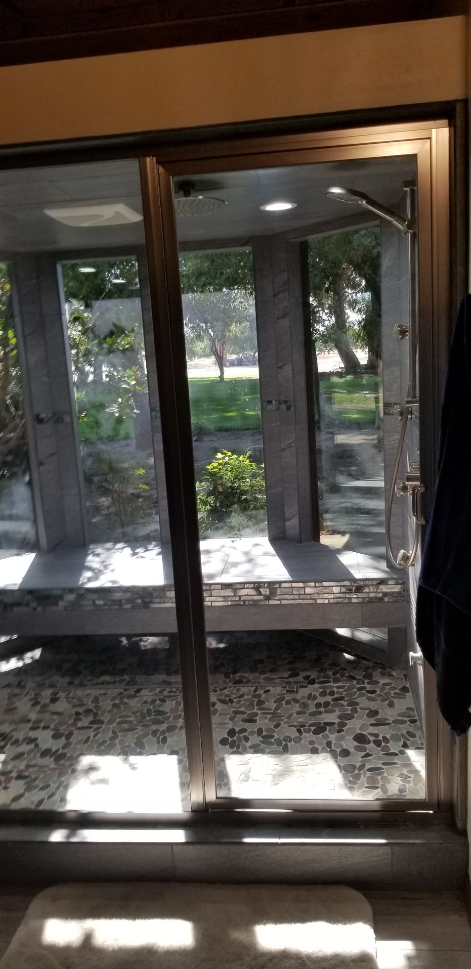 A room with a lot of windows and a sliding glass door.