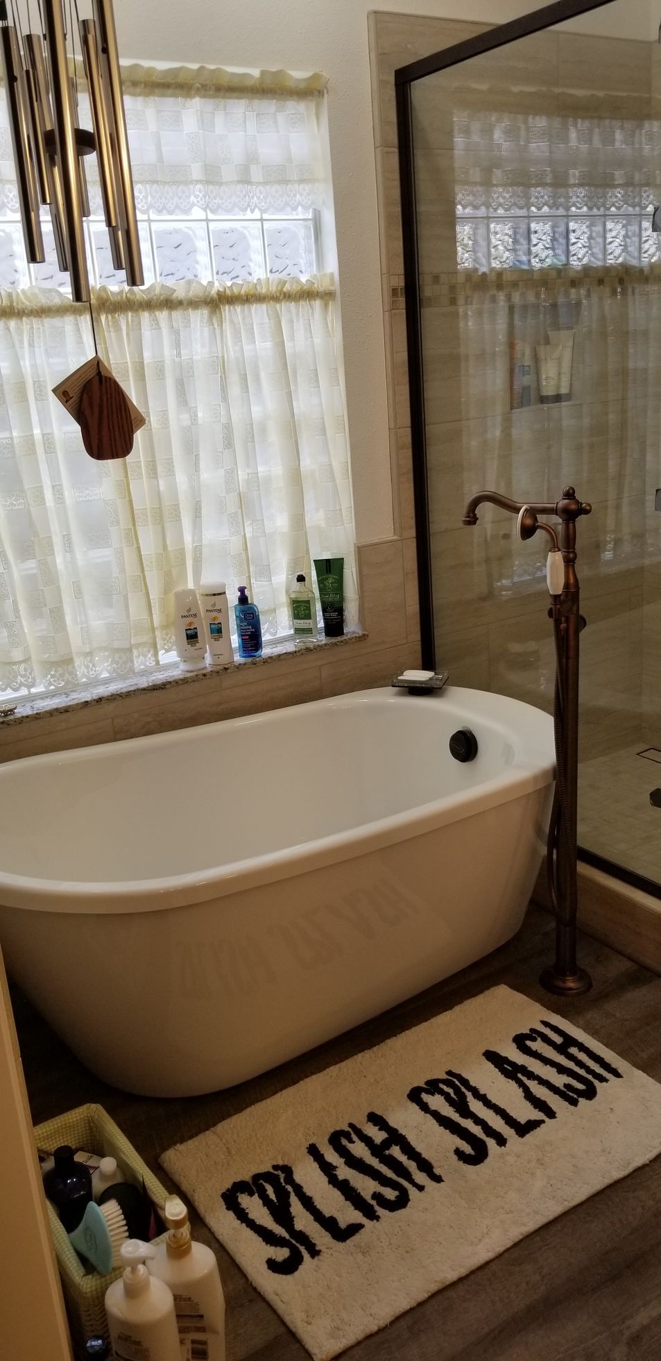 A bathroom with a bathtub and a rug that says `` splash splash ''.