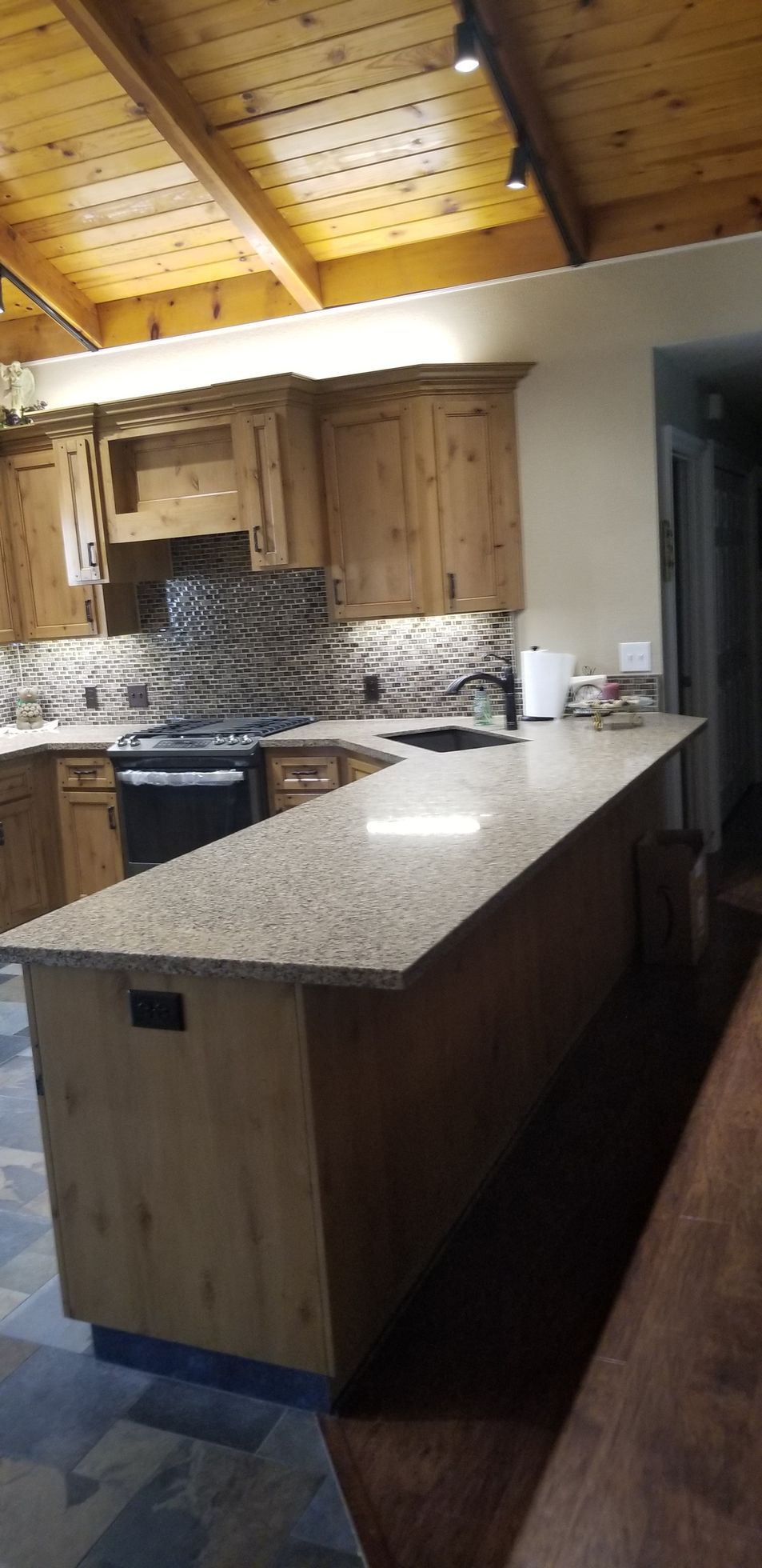 A kitchen with a large island in the middle of the room.